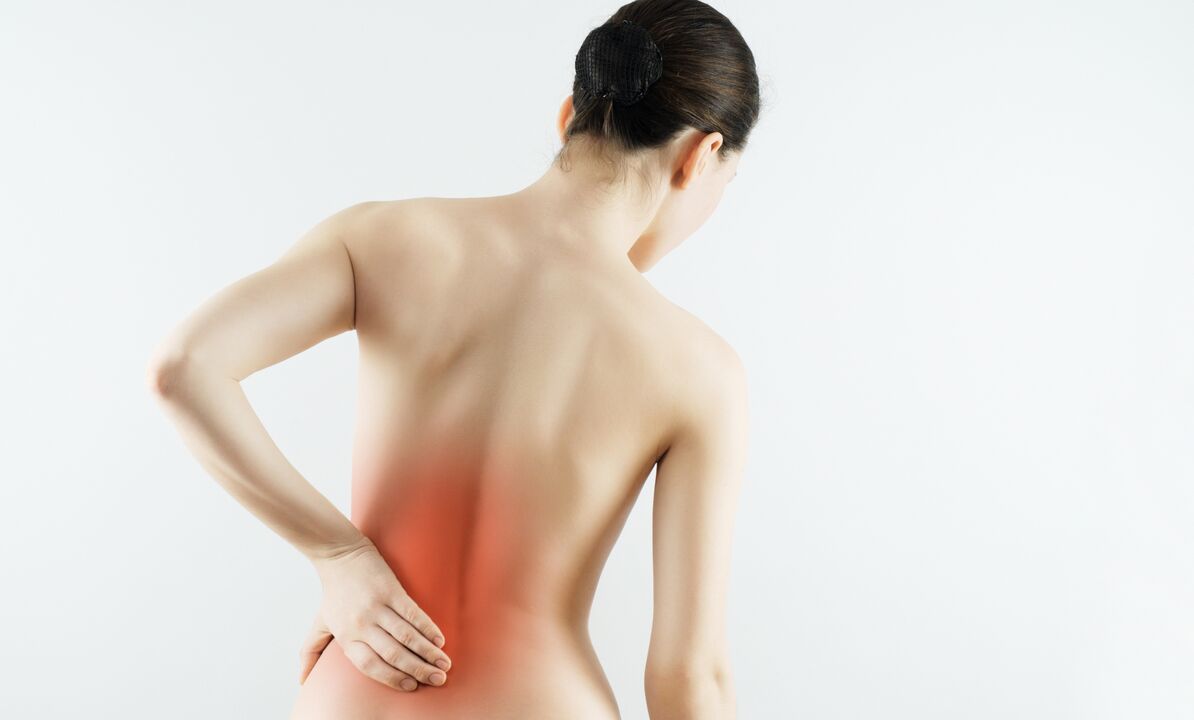 A woman is worried about pain in the lumbar region